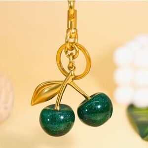 Cherries bag charm in hunter green with sparkles and gold hardware